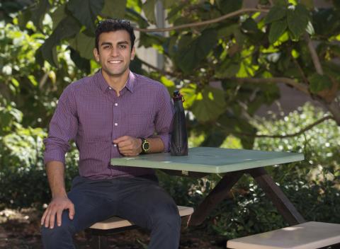 person sitting at picnic table