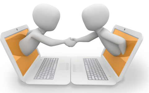 graphic of two humanoids reaching out of facing computer screens to shake hands