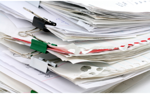 photo of a stack of papers paperclips holding several groupings